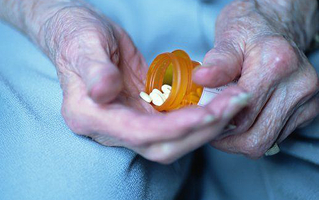 woman holding heartburn medication